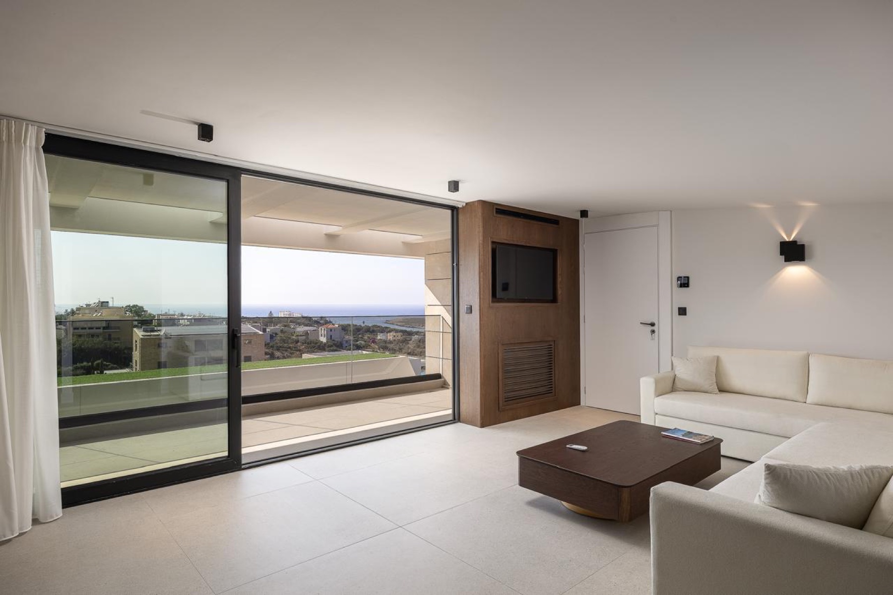 The living room opening to the sea