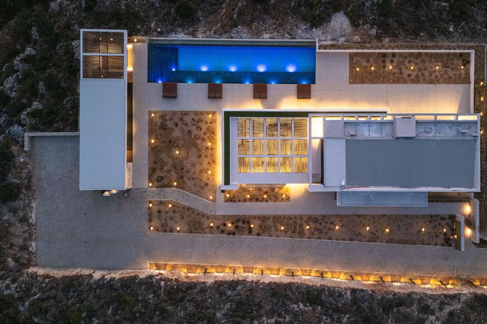 The estate lit up at night, from directly above