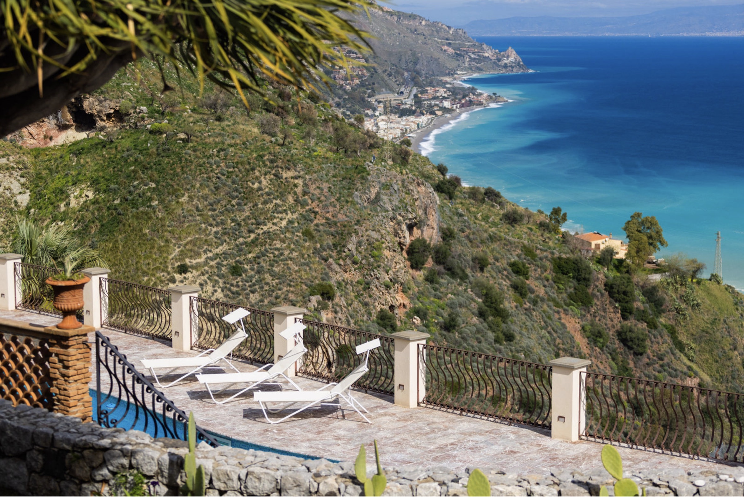 Loungers above the turquoise coast